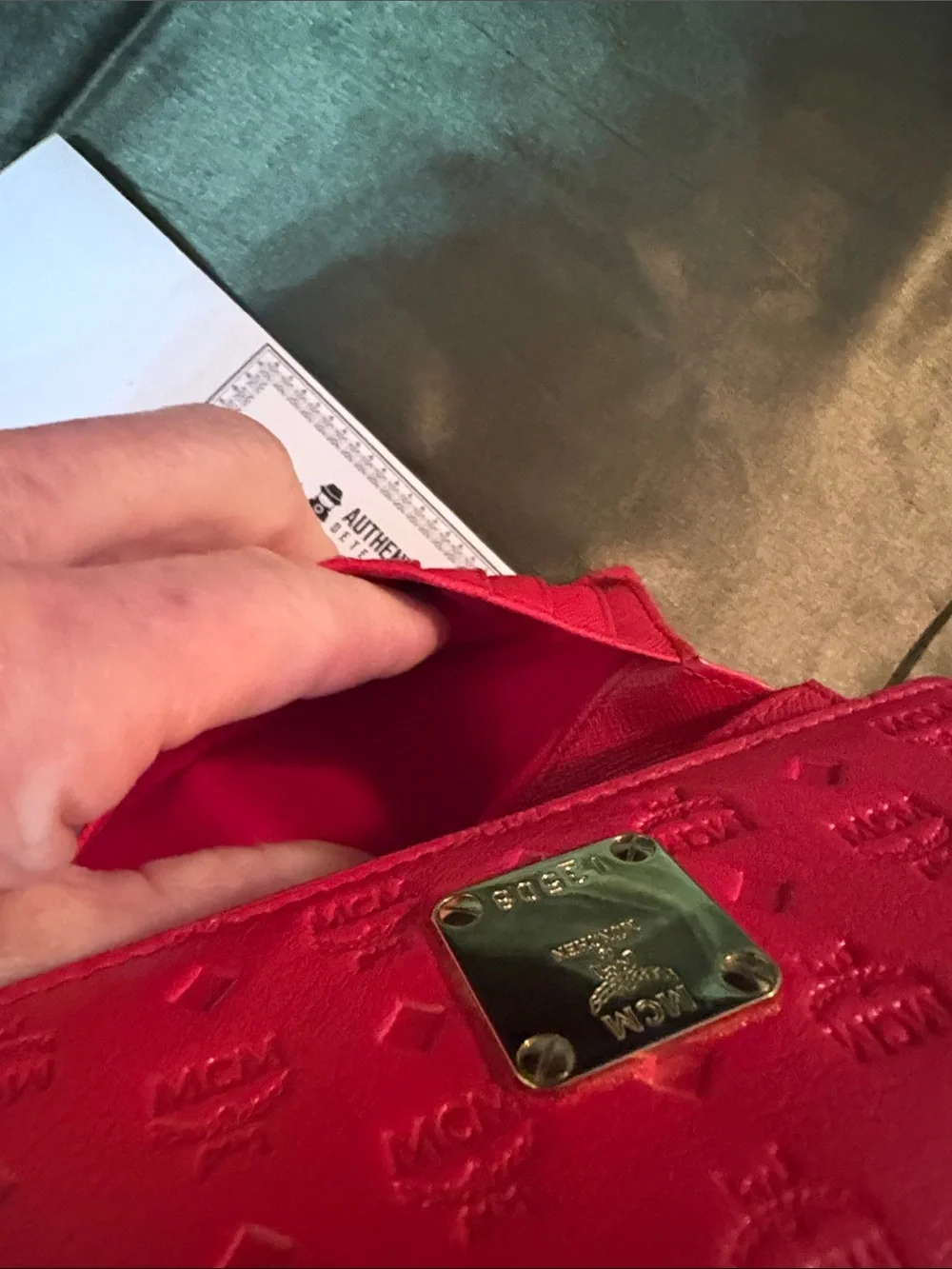 MCM Red Embossed Leather Trifold Wallet with Gold Plaque Accent
